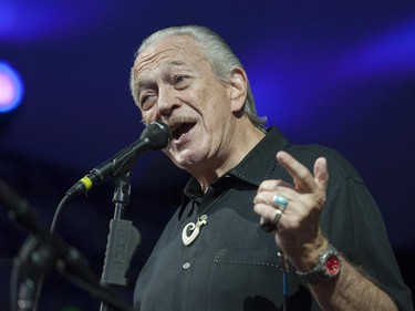 Charlie Musselwhite gestures as he performs on the Main Stage at the Ottawa Jazz Festival on Friday, June 27, 2014.