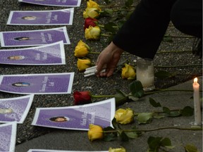 In Vancoouver's Downtown Eastside, a small vigil outside the of the delivery of the report of the Missing Women Inquiry, Dec.17, 2012.