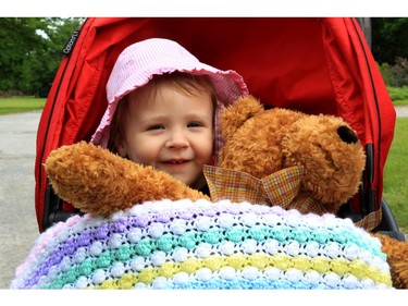 Clara Green, almost 2, arrives at the CHEO Teddy Bear pinic at Rideau Hall on Saturday.