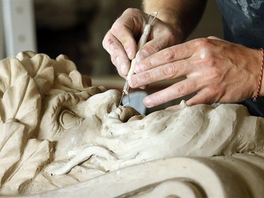 John-Philippe Smith models a clay Mascarov at the shop. The ancient trade of stonemasonry is making a revival on Parliament Hill, and Danny Barber and John-Philippe Smith (founders of Smith and Barber stonemasons in Ottawa) are two of the mason/sculptors recreating the stone carvings there.