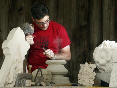 Danny Barber chisels a column base. The ancient trade of stonemasonry is making a revival on Parliament Hill, and Danny Barber and John-Philippe Smith (founders of Smith and Barber stonemasons in Ottawa) are two of the mason/sculptors recreating the stone carvings there.