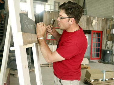 Danny Barber chisels "Namaste" on stone by hand in the shop – an art called "lettercutting."