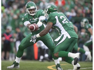 Saskatchewan Roughriders quarterback Darian Durant hands the ball off to running back Anthony Allen as they face off against the Ottawa Redblacks during the first half of CFL pre-season football action in Regina, Sask., Saturday, June 14, 2014.