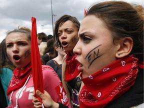 Demonstrators against French far-right National Front party chant slogans during a march from Bastille plaza to Republique Plaza, in Paris, Thursday, May 29, 2014.