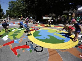 Eighty children, 26 gallons of paint and loads of sunscreen and water were in hot demand as the pavement in front of Elmdale Public School was transformed over several hours into a colourful mural on Saturday, June 7, 2014.