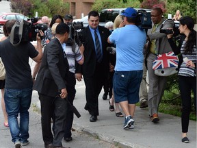 MP Dean Del Mastro is followed by media as he leaves court during a recess in Peterborough, Ont. on Monday June 23, 2014. THE CANADIAN PRESS/Sean Kilpatrick