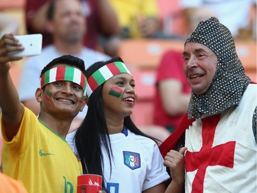 MANAUS, BRAZIL - JUNE 14:  Italy fans pose for a photograph with an England fan ahead of the 2014 FIFA World Cup Brazil Group D match between England and Italy at Arena Amazonia on June 14, 2014 in Manaus, Brazil.