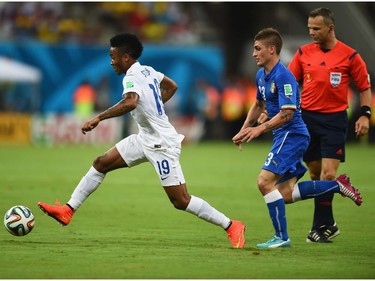 MANAUS, BRAZIL - JUNE 14:  Raheem Sterling of England dribbles past Marco Verratti of Italy during the 2014 FIFA World Cup Brazil Group D match between England and Italy at Arena Amazonia on June 14, 2014 in Manaus, Brazil.