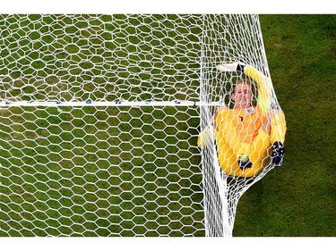 MANAUS, BRAZIL - JUNE 14: Joe Hart of England lands in the net after allowing Italy's second goal to Mario Balotelli of Italy (not pictured) during the 2014 FIFA World Cup Brazil Group D match between England and Italy at Arena Amazonia on June 14, 2014 in Manaus, Brazil.