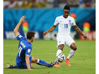 MANAUS, BRAZIL - JUNE 14:  Matteo Darmian of Italy tackles Raheem Sterling of England during the 2014 FIFA World Cup Brazil Group D match between England and Italy at Arena Amazonia on June 14, 2014 in Manaus, Brazil.