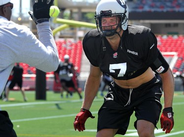 Eric Fraser keeps his eye on an approaching tennis ball during a drill. The Ottawa Redblacks held their first practice ever at the new TD Place stadium at Lansdowne Park Friday, June 27, 2014.