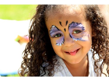 Face-painting was a popular activity at Saturday's Festival de la St-Jean, at Centre Richelieu in Vanier. Here, Olivia Duval, 3, shows off her butterfly, June 21, 2014.