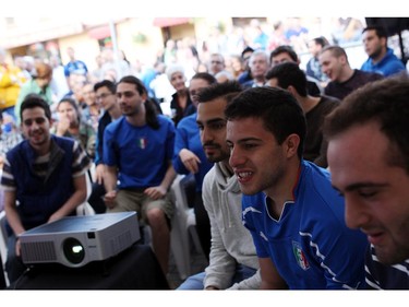Fans watch the England v. Italy World Cup soccer match on Saturday, June 14, 2014 at Allegro Ristorante on an outdoor screen in Little Italy.