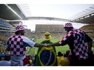 Brazilian and Croatian fans watch the Group A opening football match between Brazil and Croatia at Corinthians Arena in Sao Paulo, Brazil during the 2014 FIFA World Cup on June 12, 2014.