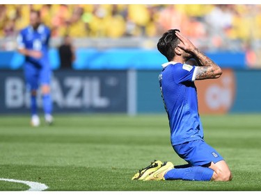 Greece's midfielder Panagiotis Kone reacts after missing a goal opportunity during a Group C football match between Colombia and Greece at the Mineirao Arena in Belo Horizonte during the 2014 FIFA World Cup on June 14, 2014.