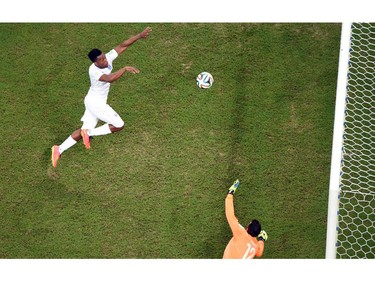 England's forward Daniel Welbeck (L) tries to score a goal as Italy's goalkeeper Salvatore Sirigu defends during a Group D football match between England and Italy at the Amazonia Arena in Manaus during the 2014 FIFA World Cup on June 14, 2014.