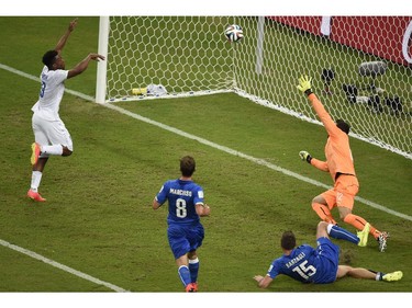 England's forward Daniel Sturridge (L) eyes the ball during a Group D football match between England and Italy at the Amazonia Arena in Manaus during the 2014 FIFA World Cup on June 14, 2014.