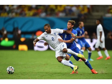 England's defender Glen Johnson (L) vies with Italy's midfielder Claudio Marchisio during a Group D football match between England and Italy at the Amazonia Arena in Manaus during the 2014 FIFA World Cup on June 14, 2014.