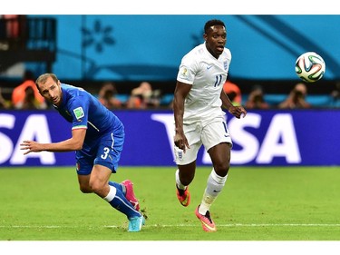 Italy's defender Giorgio Chiellini (L) and England's forward Daniel Welbeck vie for the ball during a Group D football match between England and Italy at the Amazonia Arena in Manaus during the 2014 FIFA World Cup on June 14, 2014.