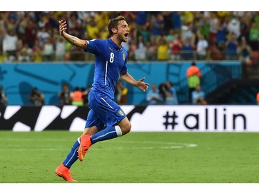 Italy's midfielder Claudio Marchisio celebrates after scoring during a Group D football match between England and Italy at the Amazonia Arena in Manaus during the 2014 FIFA World Cup on June 14, 2014.