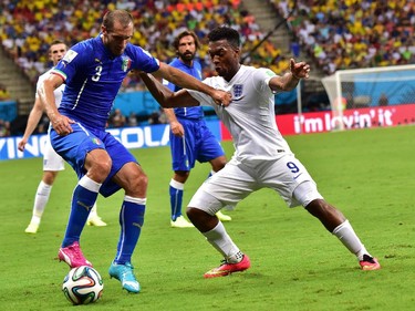 Italy's defender Giorgio Chiellini (L) and England's forward Daniel Sturridge vie for the ball during a Group D football match between England and Italy at the Amazonia Arena in Manaus during the 2014 FIFA World Cup on June 14, 2014.