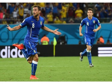 Italy's midfielder Claudio Marchisio celebrates after scoring during a Group D football match between England and Italy at the Amazonia Arena in Manaus during the 2014 FIFA World Cup on June 14, 2014.