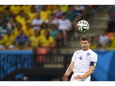 England's midfielder and captain Steven Gerrard heads the ball during a Group D football match between England and Italy at the Amazonia Arena in Manaus during the 2014 FIFA World Cup on June 14, 2014.