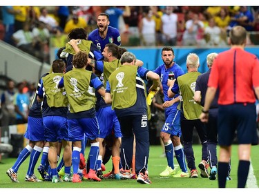 Italy's football team celebrate after scoring a goal during a Group D football match between England and Italy at the Amazonia Arena in Manaus during the 2014 FIFA World Cup on June 14, 2014.