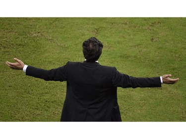 Italy's coach Cesare Prandelli gestures during a Group D football match between England and Italy at the Amazonia Arena in Manaus during the 2014 FIFA World Cup on June 14, 2014.