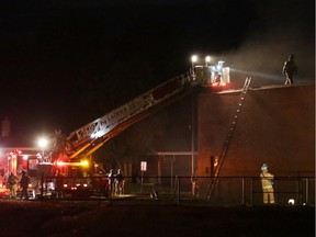 A fire department spokesman said it appeared the fire on Monday night at an abandoned school was confined to the floor of the school gymnasium.