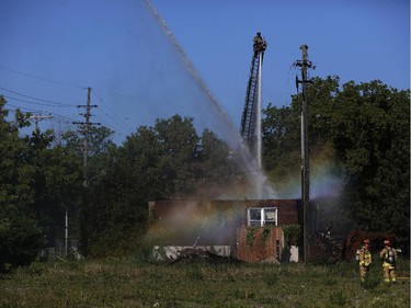 Firefighters extinguished a blaze in an uninhabited building early Saturday morning on Presland Road near the Vanier Parkway on June 7, 2014.