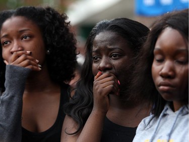 Friends of murdered teen Brandon Volpi mourn their classmate, friend, and family member at a vigil in front of Les Suites on Sunday, June 8, 2014.