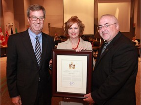 Mayor Jim Watson and Coun. Allan Hubley presented the Mayor's City Builder Award to Laura Dubois on June 25  for her outstanding contributions to the Kanata community through her support of dozens of schools- charities and other community organizations.