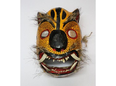 Part of the exhibit of traditional Mexican masks at La Petite Mort gallery.