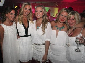 From left, Debbie Duncan, Erin Phillips, Tia Borden, Nathalie Cardif and Kathleen Sheppard at the Bash en Blanc party for the Snowsuit Fund, held Friday, June 20, 2014, at Lago's Bar Grill View.