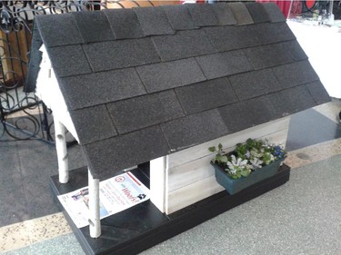 Entry by Olive and Ella Interior Design in the Homes with Woofs fundraiser for the Ottawa Humane Society June 12, 2014. Labeled the most charming entry by the judges, it was inspired by the creator's own cottage and includes cedar shakes, flower boxes and birch posts. It sold for $425.