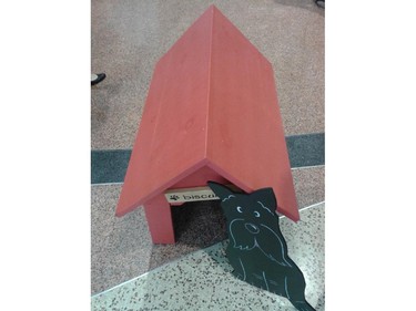 A simple red doghouse inspired by Snoopy was one of the entries in the Homes with Woofs fundraiser for the Ottawa Humane Society June 12, 2014. Created by Historic Building Co., the judges dubbed it the most classic and it sold for $180.