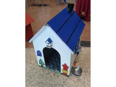 DS Plumbing played to its strengths in creating this entry for the Homes with Woofs fundraiser for the Ottawa Humane Society June 12, 2014. It includes a working pump and reservoir for filling up the dog's water bowl. The whimsical painting is courtesy of Days End Studio. The doghouse sold for $350.