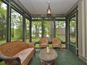 The screened-in porch, featuring more inscriptions, overlooks the lawn and guest house.