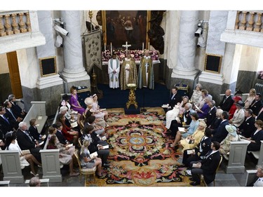 Front row right, from left, Christopher O'Neill, Princess Leonore, on her mother's lap, Princess Madeleine, King Carl XVI Gustaf of Sweden,  Queen Silvia, Eva O'Neill, Prince Carl Philip and Prince Daniel sit during Princess Leonore's christening in the Drottningholm Palace church outside Stockholm, Sweden, Sunday, June 8, 2014.