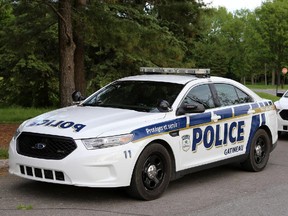 Gatineau and Ottawa police cruisers at Duchesne Rapids in Ottawa, Sunday, June 1, 2014. Two men were in a small boat which capsized. One man has been rescued, the other has not yet been located. A water rescue (or recovery) continues late into the evening. Mike Carroccetto / Ottawa Citizen NEG#117257