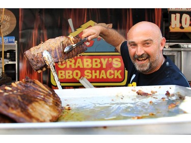 George Kefalidis says the secret to making great ribs is cooking them "low and slow." At the Ottawa Ribfest Sunday.