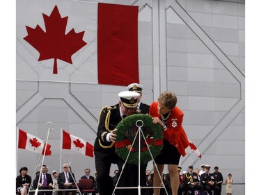 Governor General David Johnston and his wife Sharon lay a wreath during a ceremony in Ottawa, Friday June 6, 2014 marking the 70th Anniversary of D-Day and the Battle of Normandy.