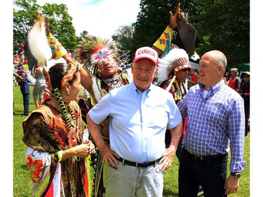 Governor General David Johnston (centre) and U.S. Ambassador to Canada Bruce Heyman (right) attend a powwow at the Summer Solstice Aboriginal Arts Festival in Ottawa, Saturday June 21, 2014. THE CANADIAN PRESS/Fred Chartrand