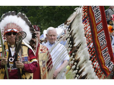 Governor General David Johnston (centre) attends a powwow at the Summer Solstice Aboriginal Arts Festival in Ottawa, Saturday June 21, 2014. THE CANADIAN PRESS/Fred Chartrand