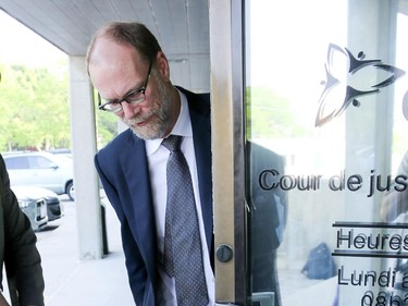 Defence attorney for Robocall defendant Michael Sona arrives at the courthouse in Guelph Ontario for the first day of the trial on June 2, 2014. The trial will focus on allegations that robocalls or real-person calls were made to voters (mostly in the riding of Guelph, Ontario) to dissuade voters from casting ballots in the May, 2011 federal election, by telling them the their polling station location had been changed.