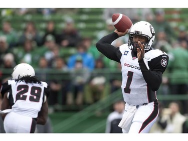 Ottawa Redblacks quarterback Henry Burris throws a pass against the Saskatchewan Roughriders during first half of CFL pre-season football action in Regina, Sask., Saturday, June 14, 2014.