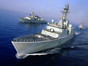 HMCS Iroquois, Arabian Gulf. 6 May 2003- HMCS IROQUOIS (centre forward), HMCS REGINA (left) and HMNZS Te Mana (A New Zealand warship positioned rear) sail in a diamond formation in the Arabian Gulf.