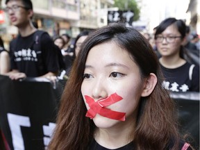 Pro-democracy activists march to mark the 25th anniversary of Tiananmen Square massacre, on June 1, 2014 in Hong Kong.