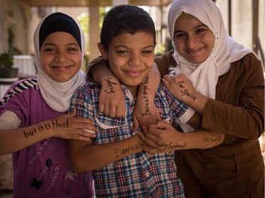 "I miss my friends, my family. I want to go back, but it is hard. Safety for Syria"Photographers Robert Fogarty and Benjamin Reece first gave Syrian refugees felt-tip markers. The refugees wrote messages to world leaders on their arms and hands and were then photographed.